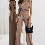 Brigitte - Ebakorrapärase ülaosa ja laiade pükste komplekt