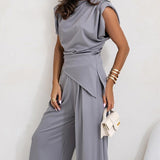 Brigitte - Ebakorrapärase ülaosa ja laiade pükste komplekt